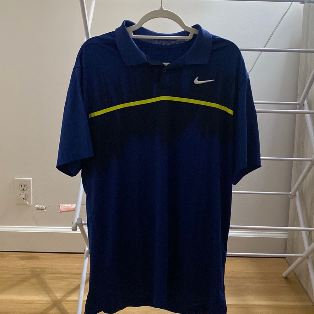Nike Golf size Large blue shirt with yellow stripe